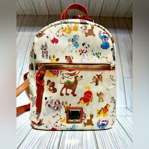 Dooney & Bourke Disney holiday dogs backpack purse.